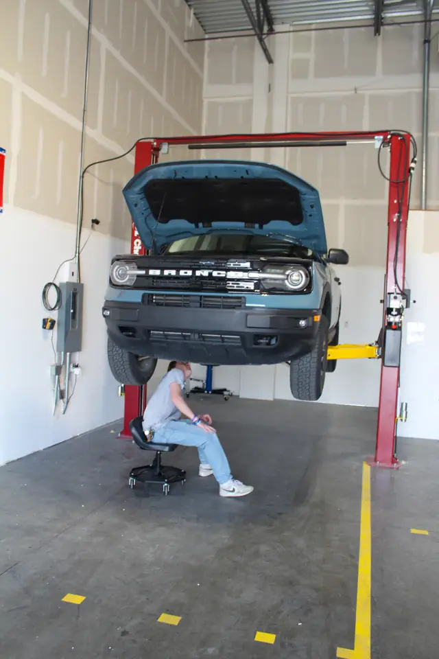 Car raised on a two-post lift